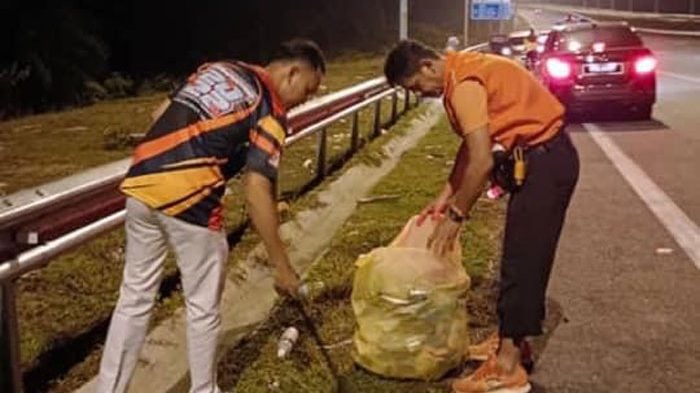 视频 | 连假回乡大道垃圾处处 2青年清理逾10袋垃圾