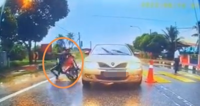 视频|校工示意可过马路  小学生下一秒被摩托撞飞 