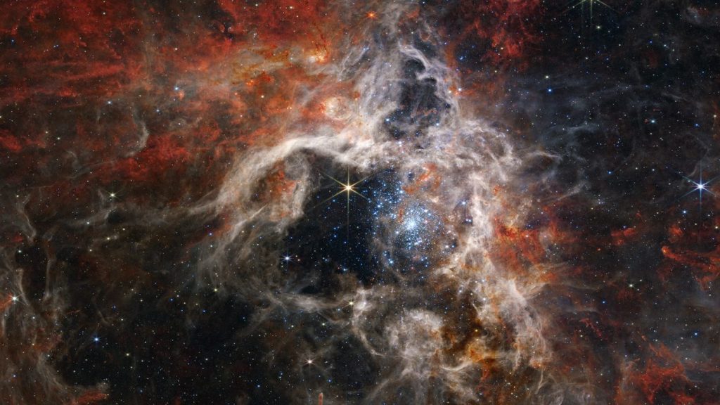 数以千计年轻恒星！ 韦伯望远镜捕捉到巨大“太空狼蛛”