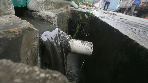 排屋地下污水倒流  维修费 发展商承担？