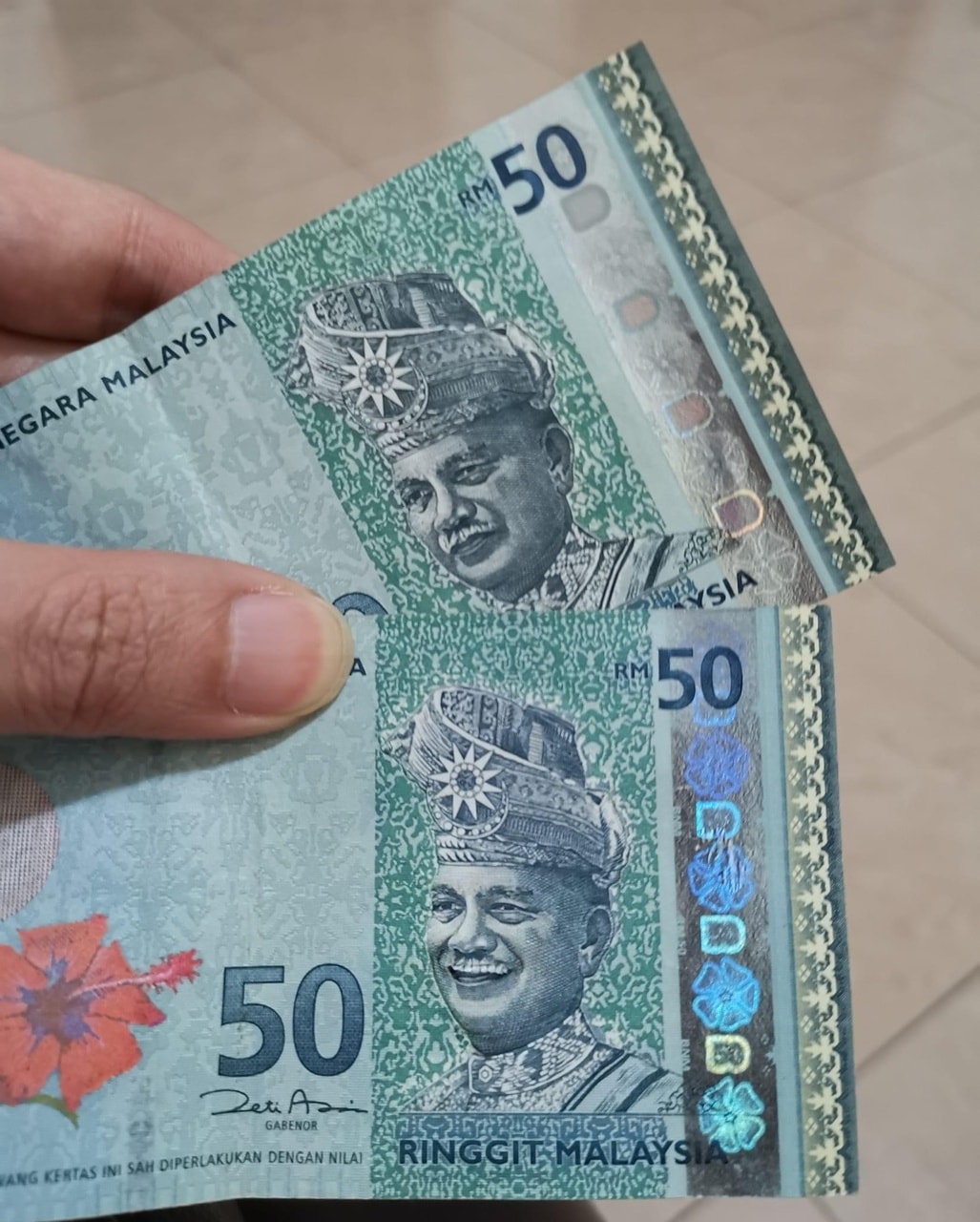 “阿公”笑了？网传市面RM50假钞 元首肖像微笑吓人