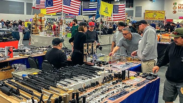 At California gun fair, few speak of recent massacres