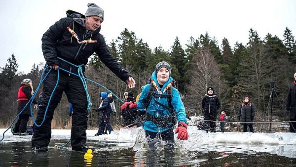 Swedish kids take the plunge in icy lake survival lessons