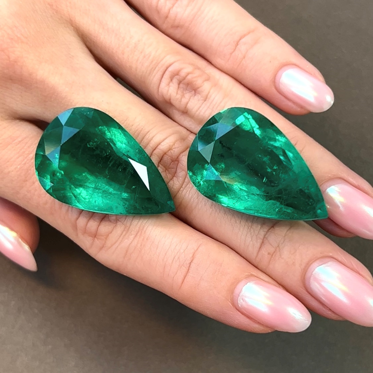 A pair of pear-shaped emeralds (45.84ct & 42.55ct) totalling 88.39ct