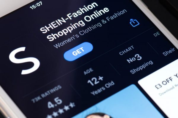 Guilherand-Granges, France - February 08, 2021. Smartphone with Shein app logo. Fast online fashion retail service based in China.