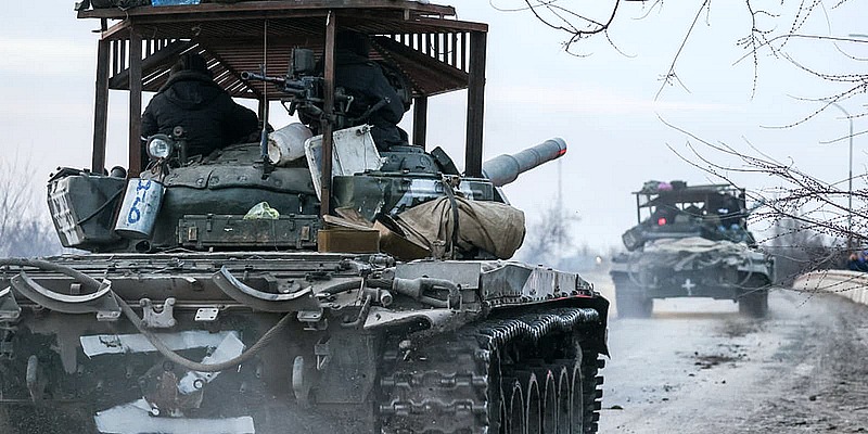 Russian tanks move across the town of Armyansk in northern Crimea on Feb. 24, 2022.