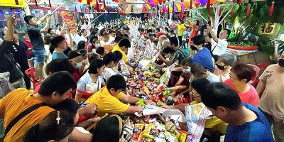 Devotees in a race to grab prayer offerings for blessings