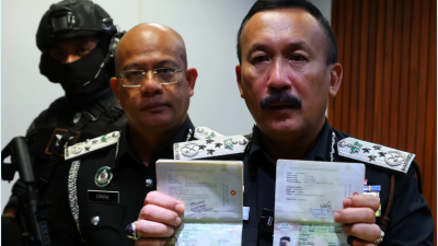 视频|移民局捣毁伪造证件集团 起211护照 捕2外籍男女